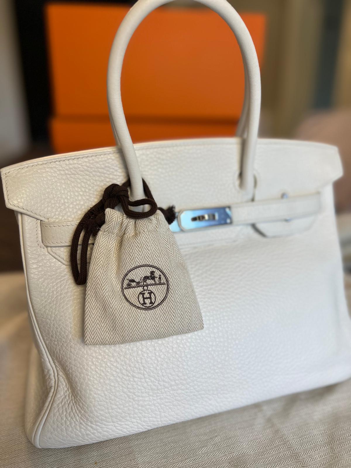 Rare white Birkin handbag with protective dust bag