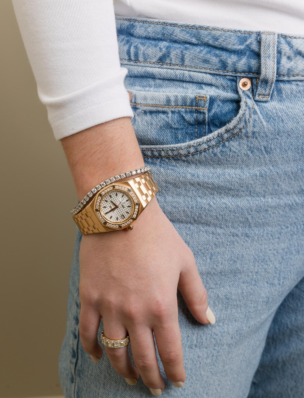 Audemars Piguet Royal Oak worn with a tennis bracelet and diamond ring