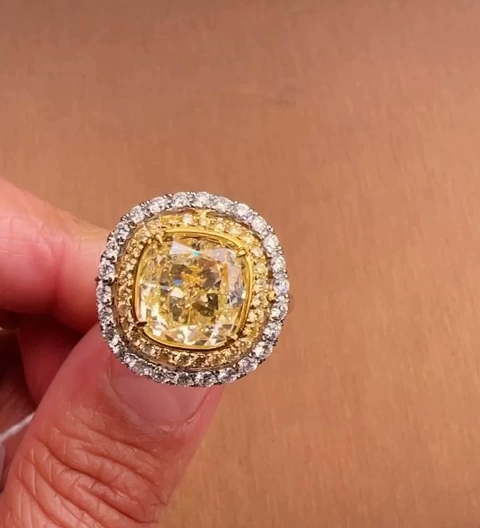 Cushion-cut estate diamond ring with layered halo