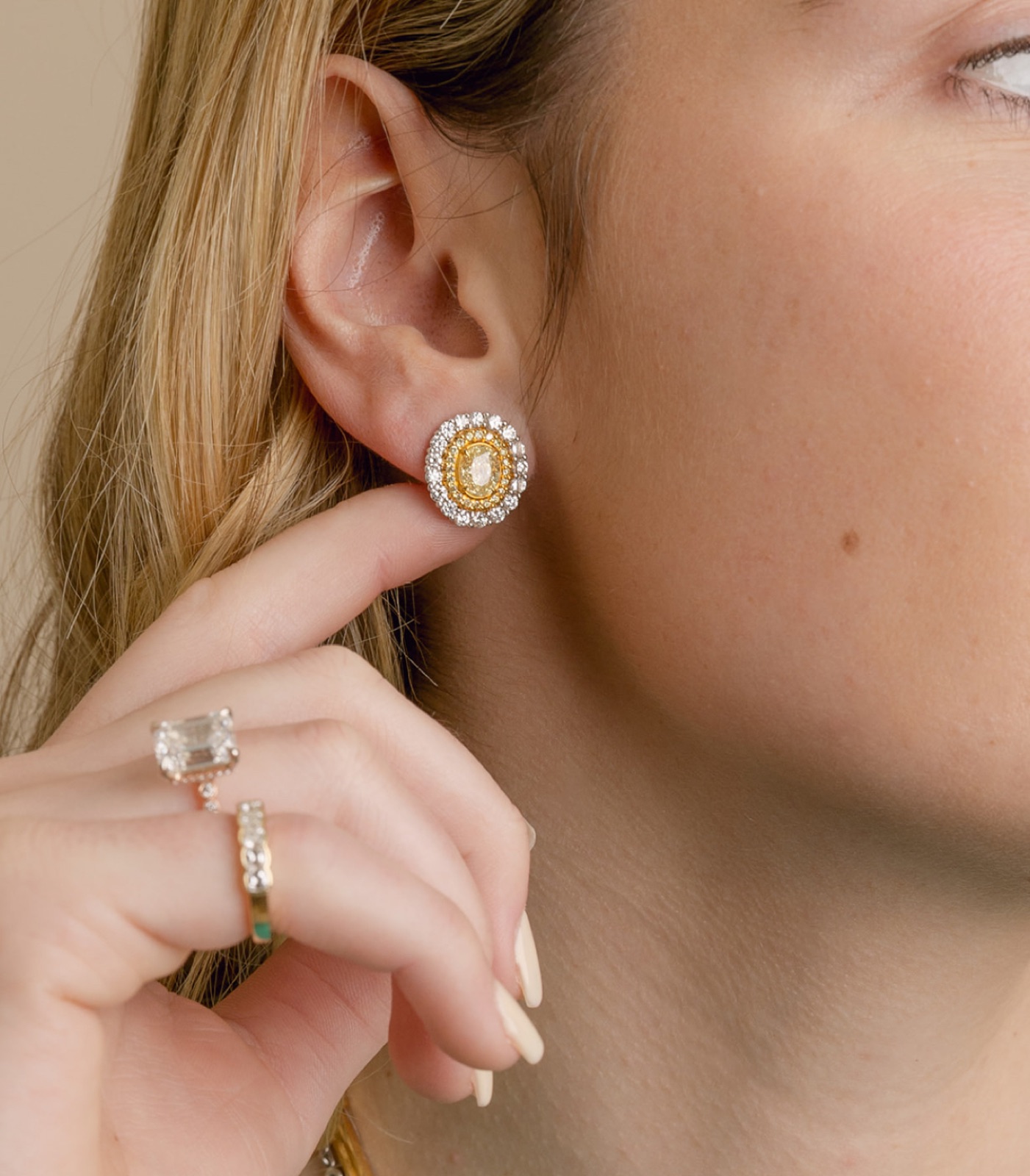Yellow diamond earrings with diamond halos