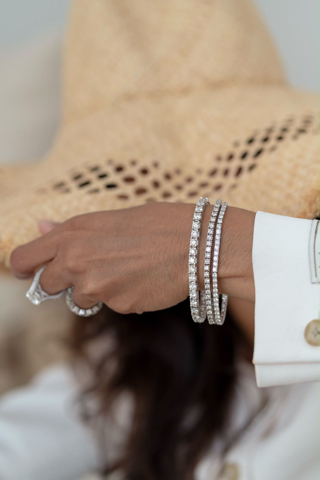 A diamond tennis bracelet styled at the wrist