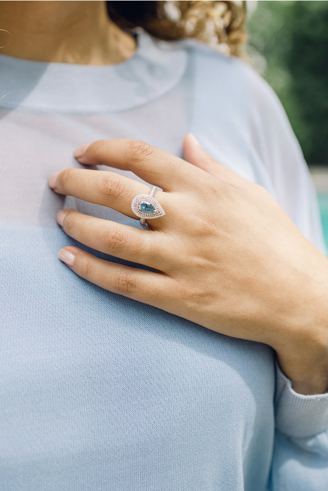 Rare pear-shaped blue diamond ring with a double halo