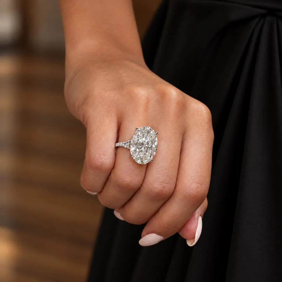Elongated oval split-shank diamond ring worn on the hand